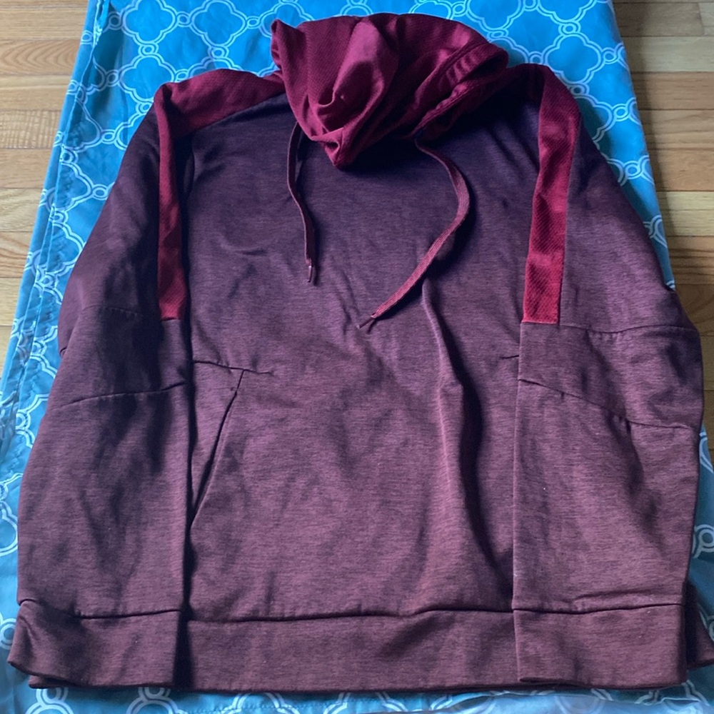 i am selling a red hoodie with the hood and big pockets